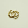 Dainty Pavé CZ Huggie Hoop Earrings Gold — pair overlapping flat lay on white