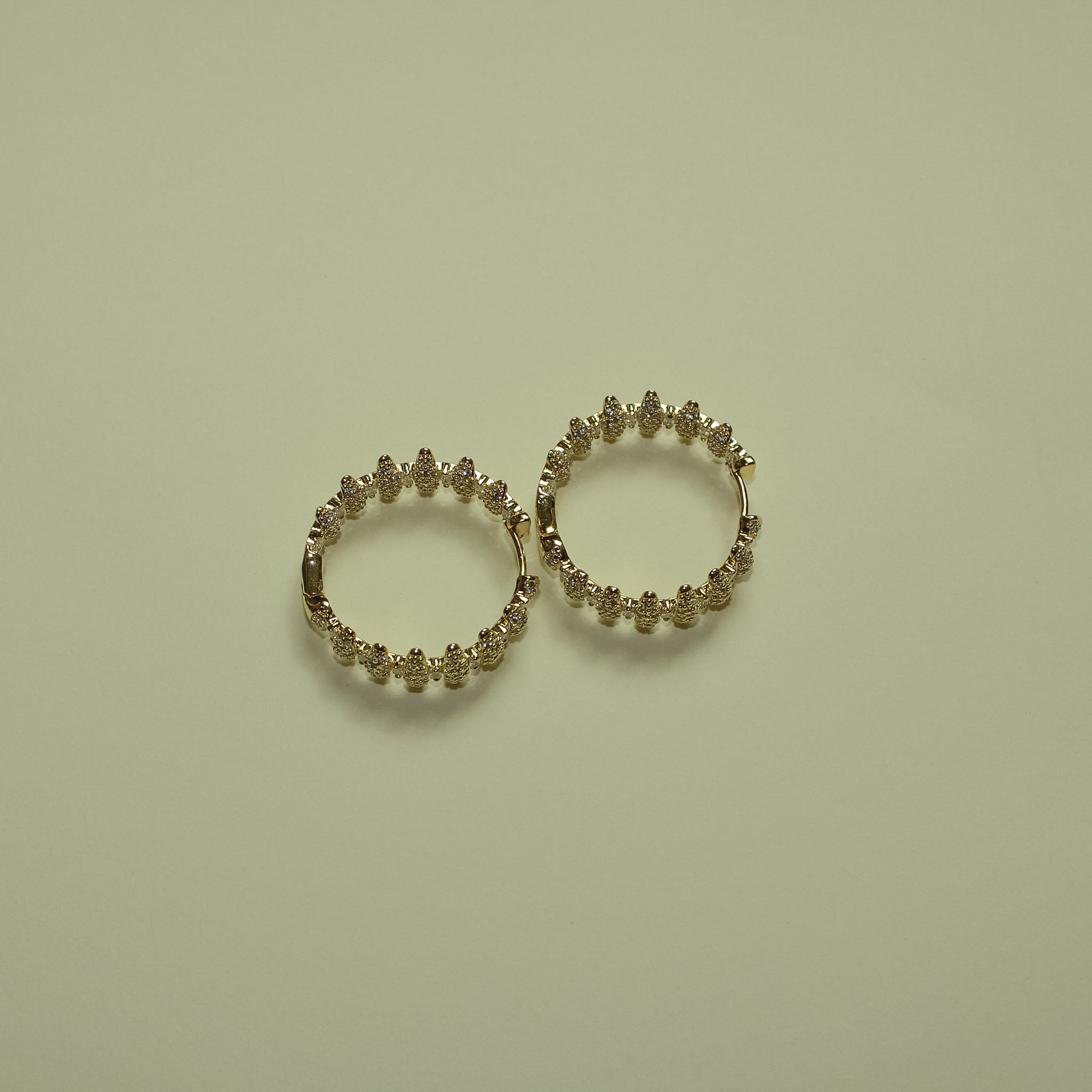 Pavé CZ Spike Hoop Earrings 14K Gold — pair separated flat lay