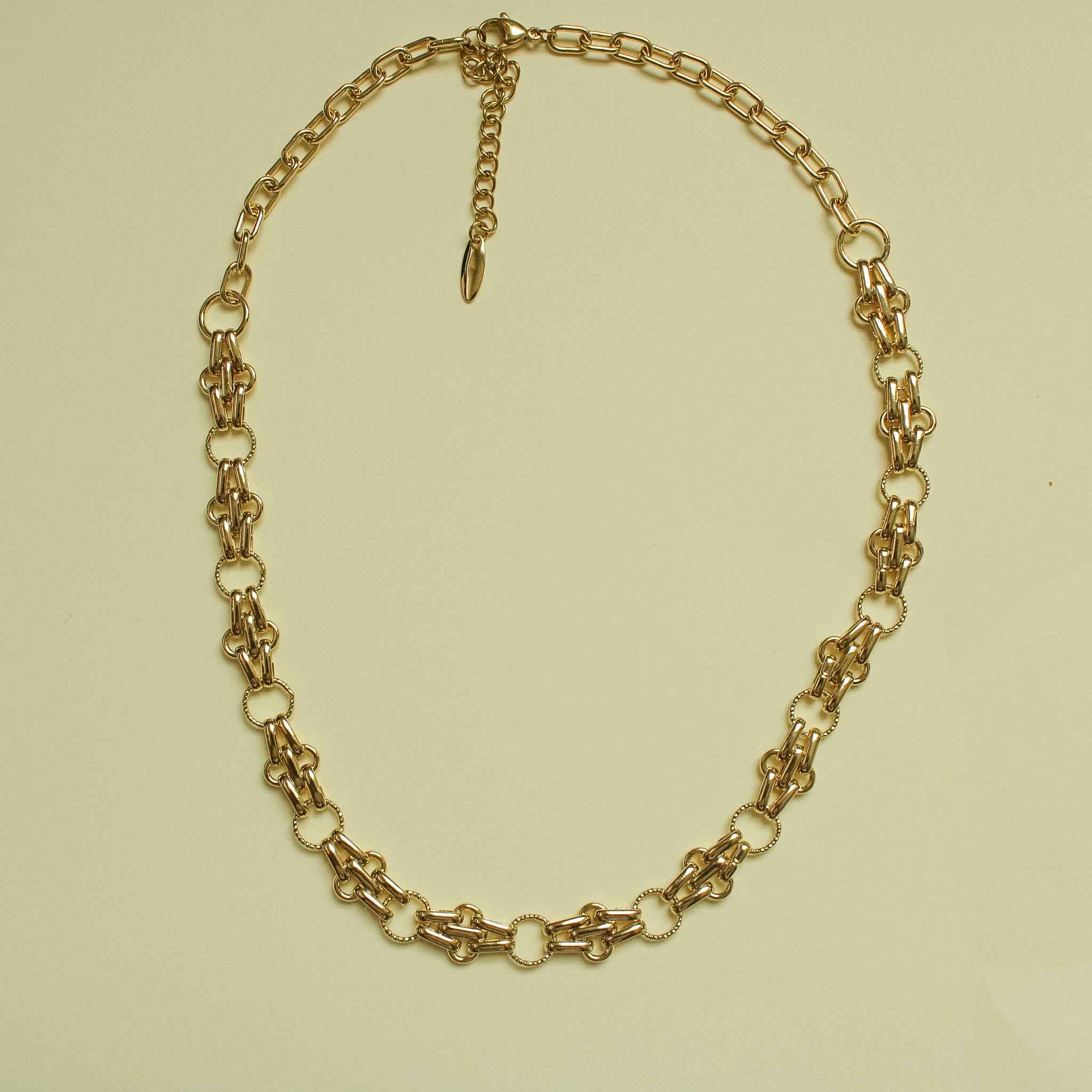 Gold-plated chain link necklace with teardrop charm drop, full oval silhouette