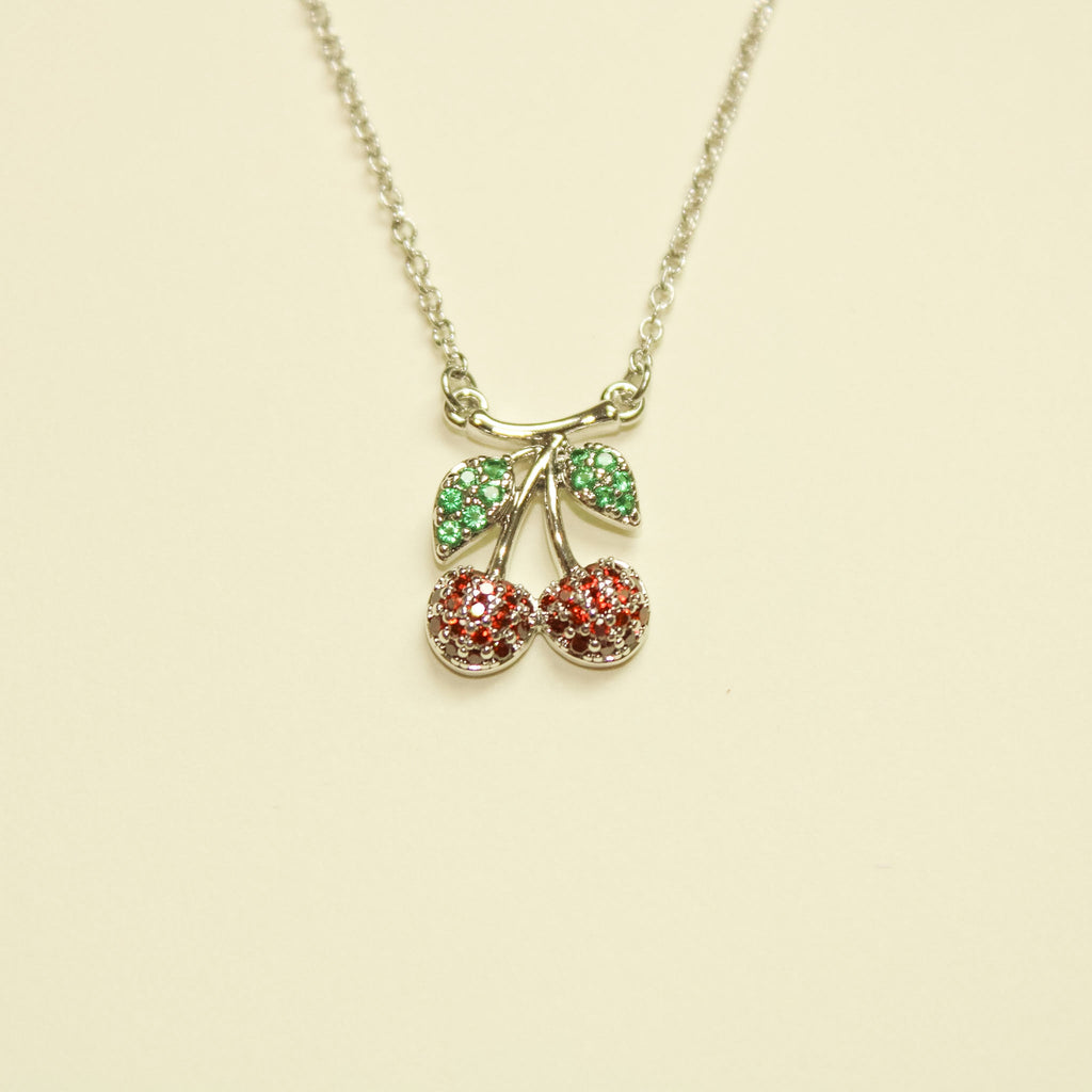 Pavé CZ Cherry Pendant Necklace Silver — cherry charm close-up showing red and green CZ detail