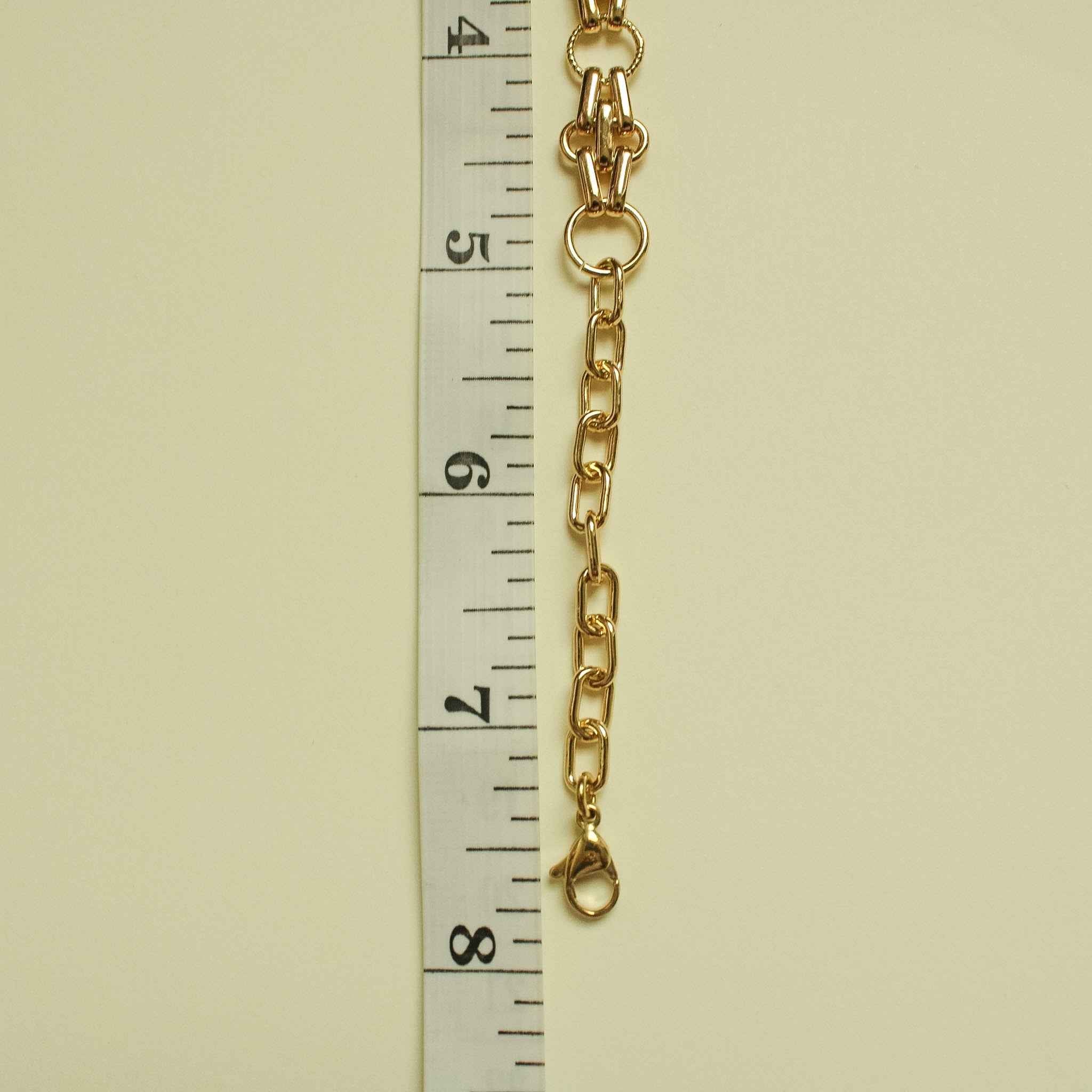 Gold-plated chain bracelet with interlocking oval links and small teardrop charm