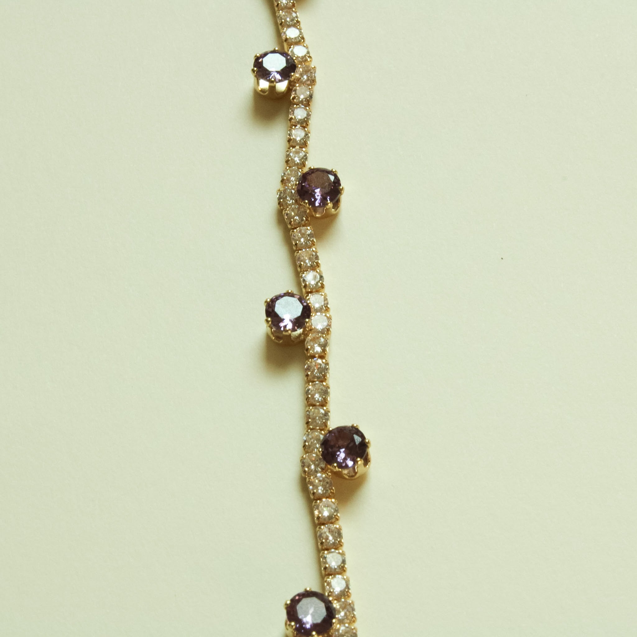 Amethyst CZ station tennis bracelet with gold-plated chain and purple stones