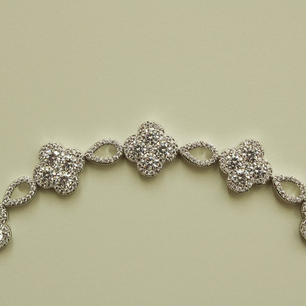 Close-up of CZ clover flower bracelet with sparkling round clover center stones