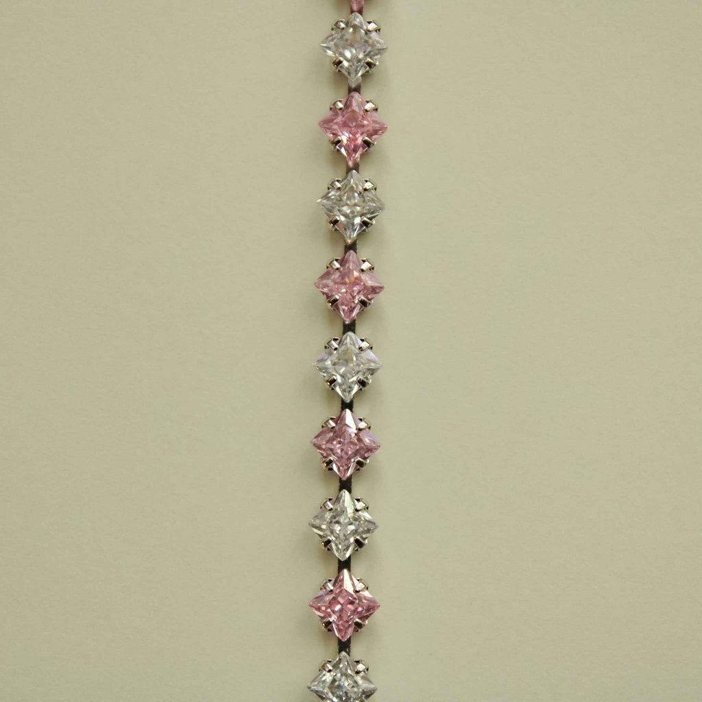 Tennis bracelet featuring alternating pink and clear princess-cut CZ stones