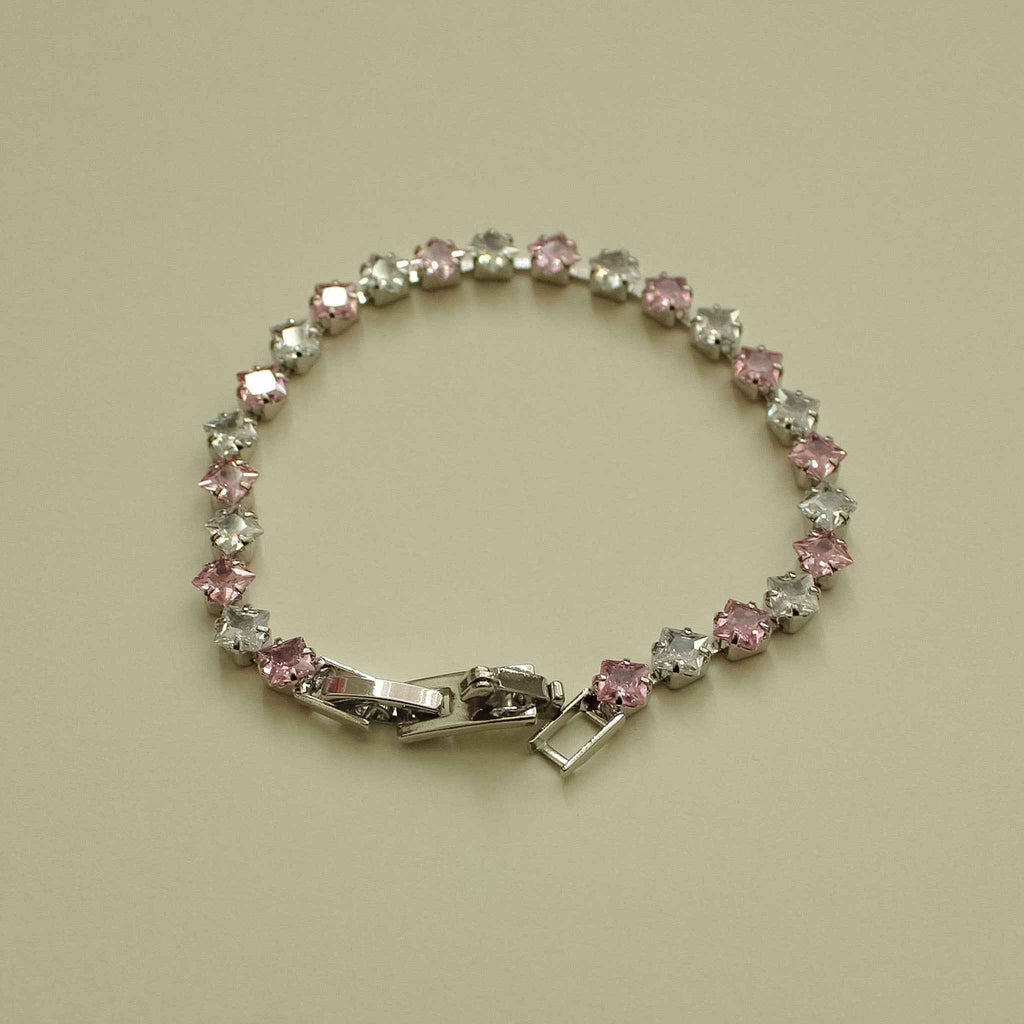 Tennis bracelet with pink and clear princess-cut CZ stones and hinged clasp