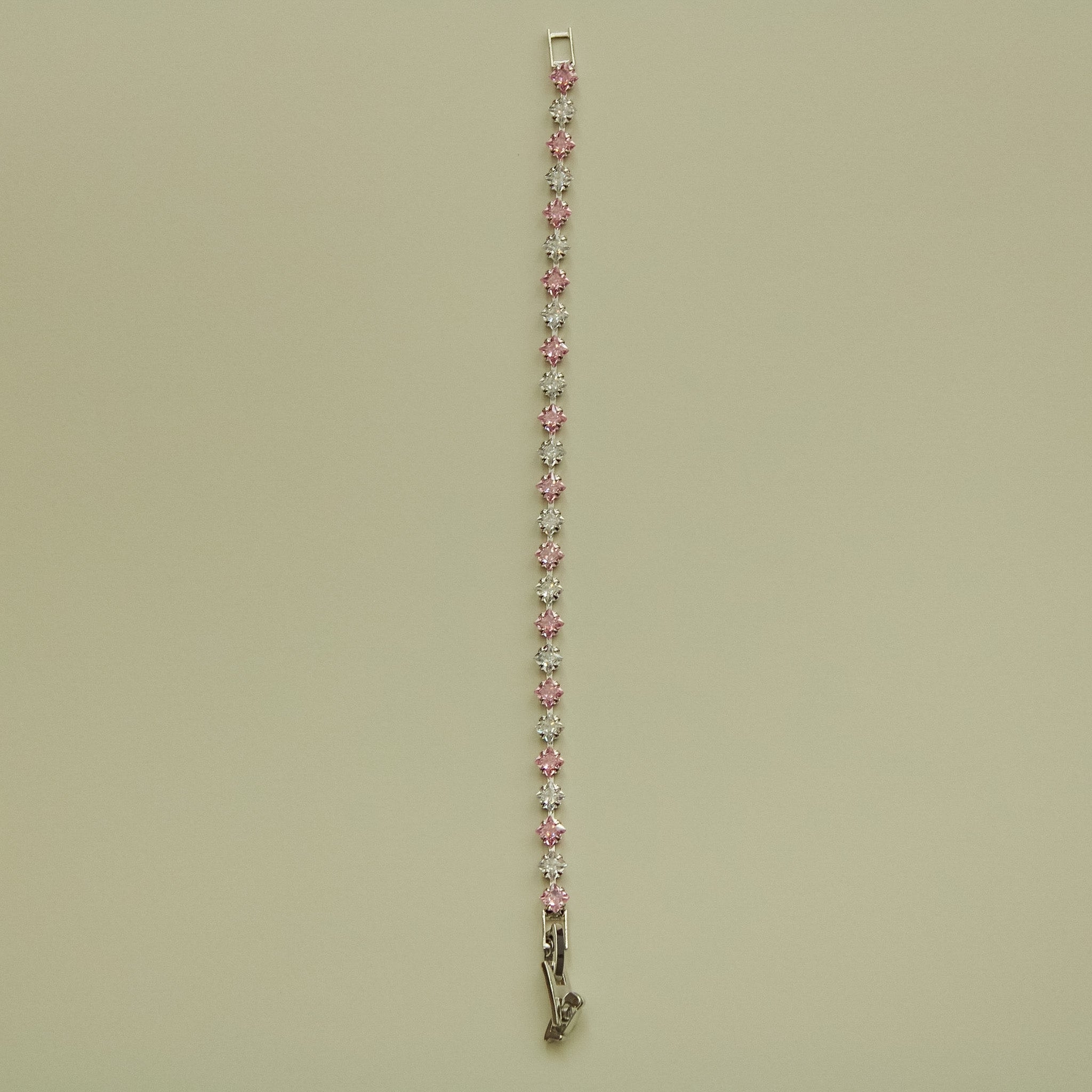 Tennis bracelet with pink and clear princess-cut CZ stones in a row