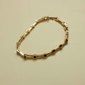 Black CZ Bezel Station Gold Bar Bracelet