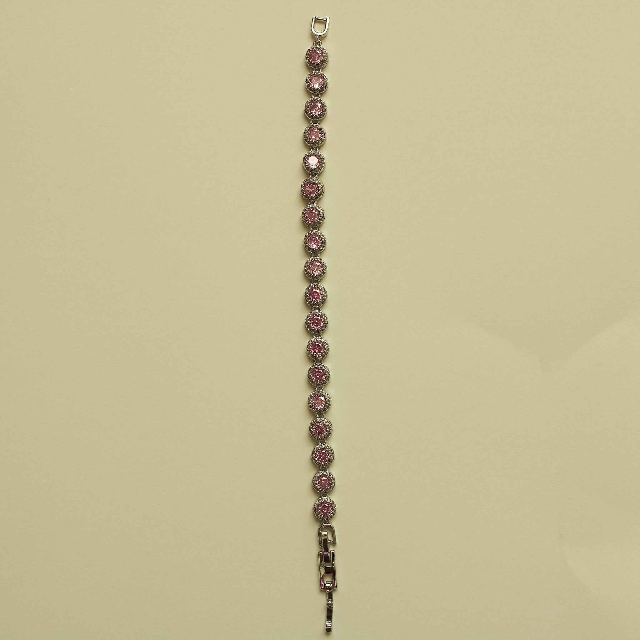 Pink halo CZ tennis bracelet with small loop clasp and row of round stones