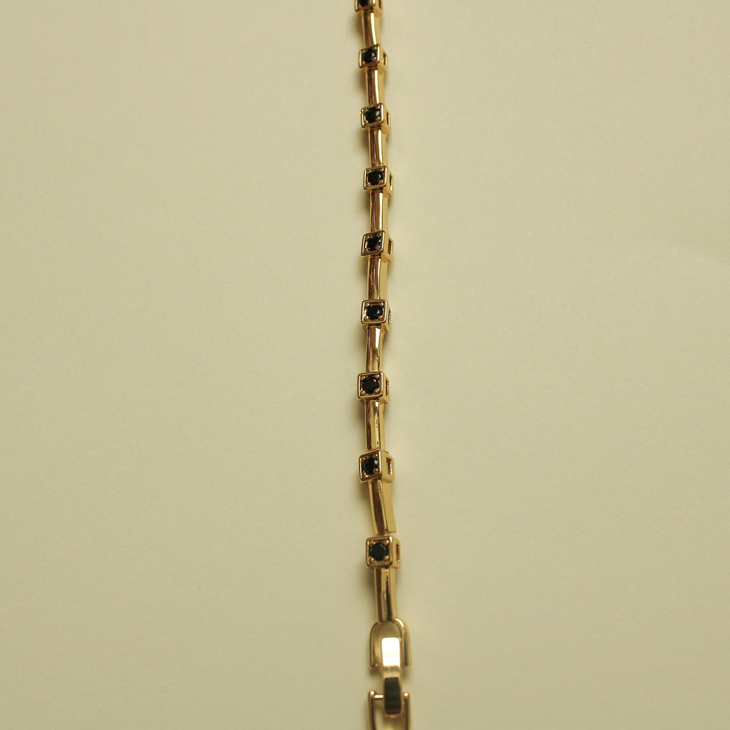 Black CZ Bezel Station Gold Bar Bracelet