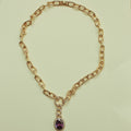 Gold paperclip chain necklace with amethyst-style purple gemstone drop pendant