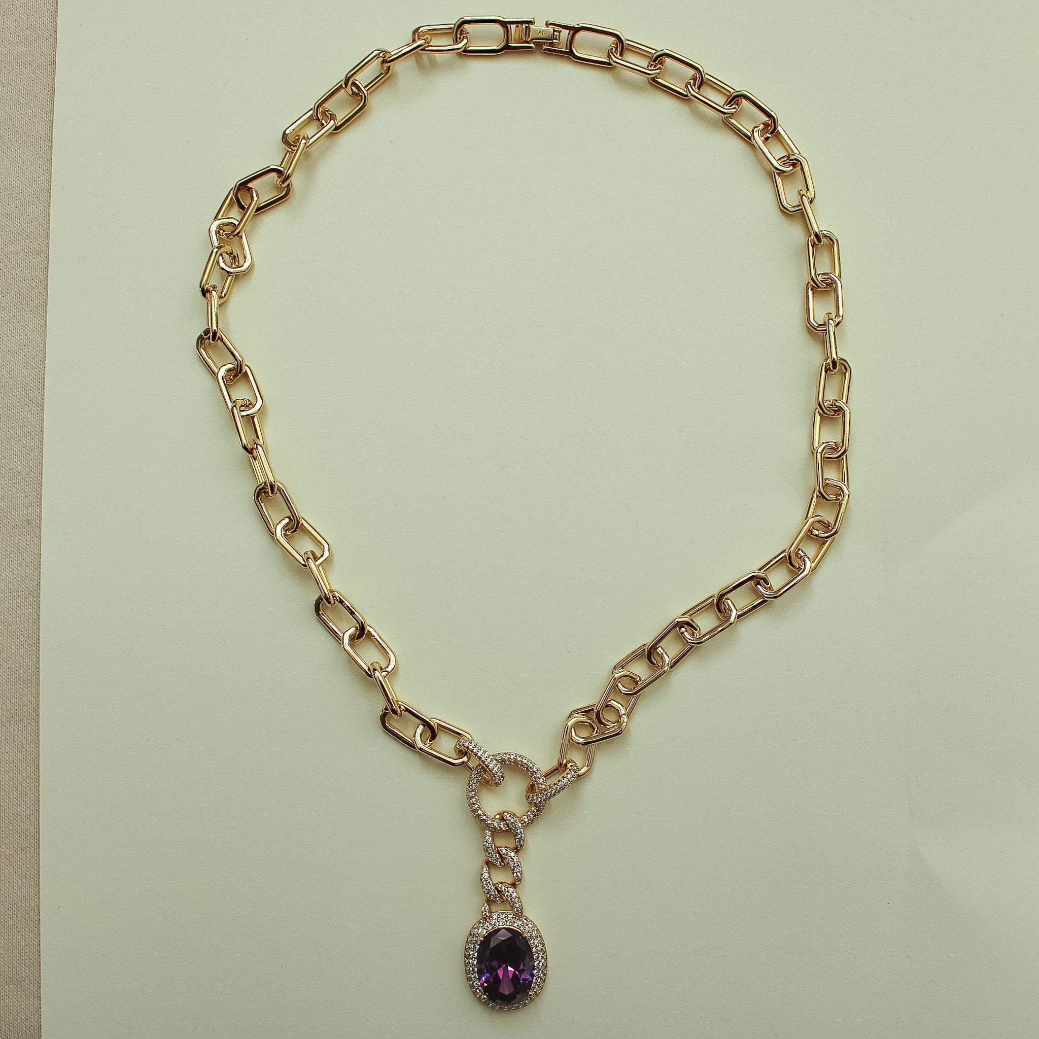Gold paperclip chain necklace with purple oval gemstone drop pendant