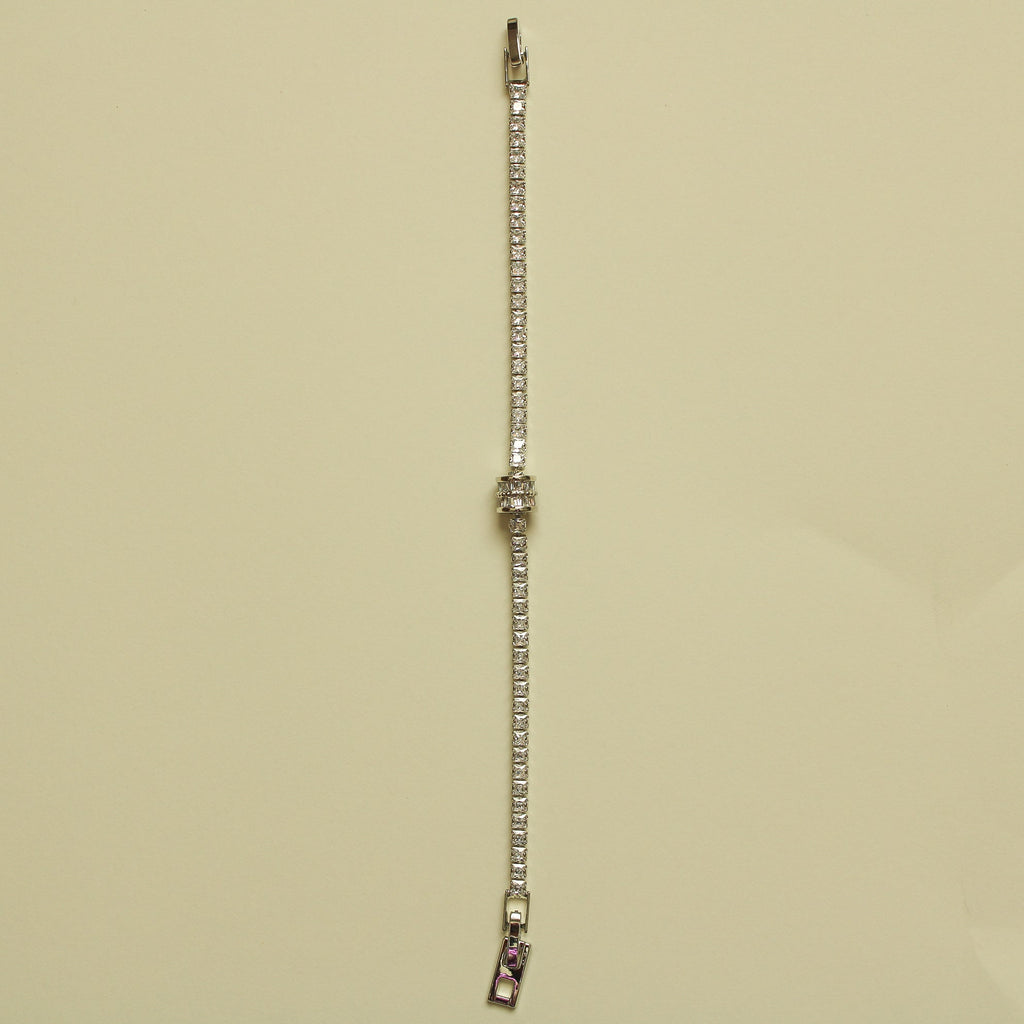 Silver tennis bracelet end with faceted stones and metal connector