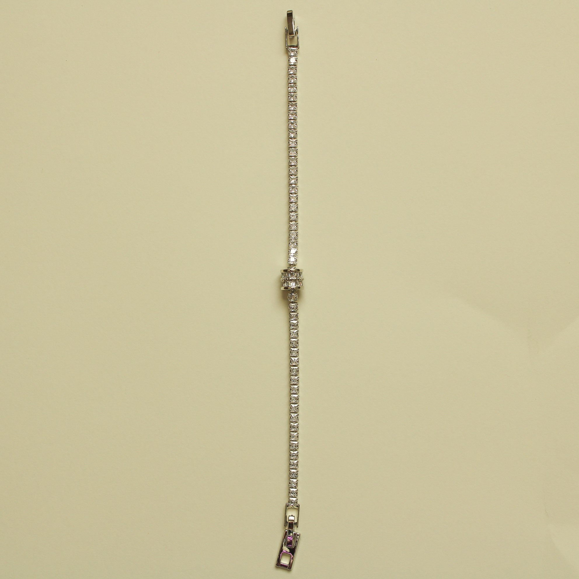 Silver tennis bracelet end with faceted stones and metal connector