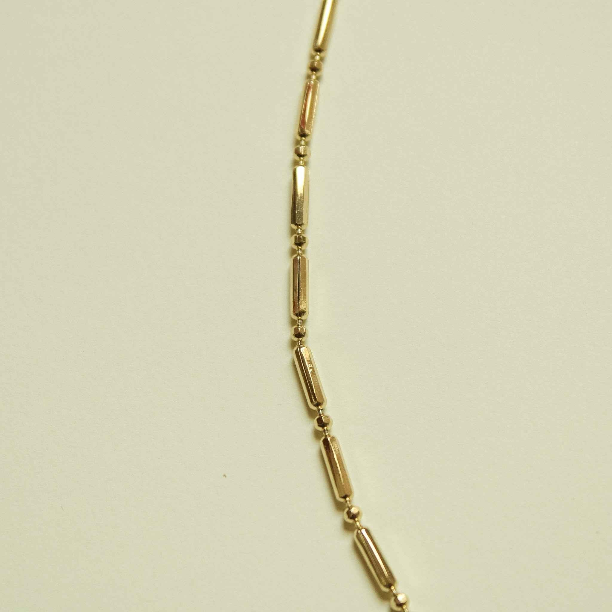 14K gold bar and bead chain necklace, angled close-up of tube links