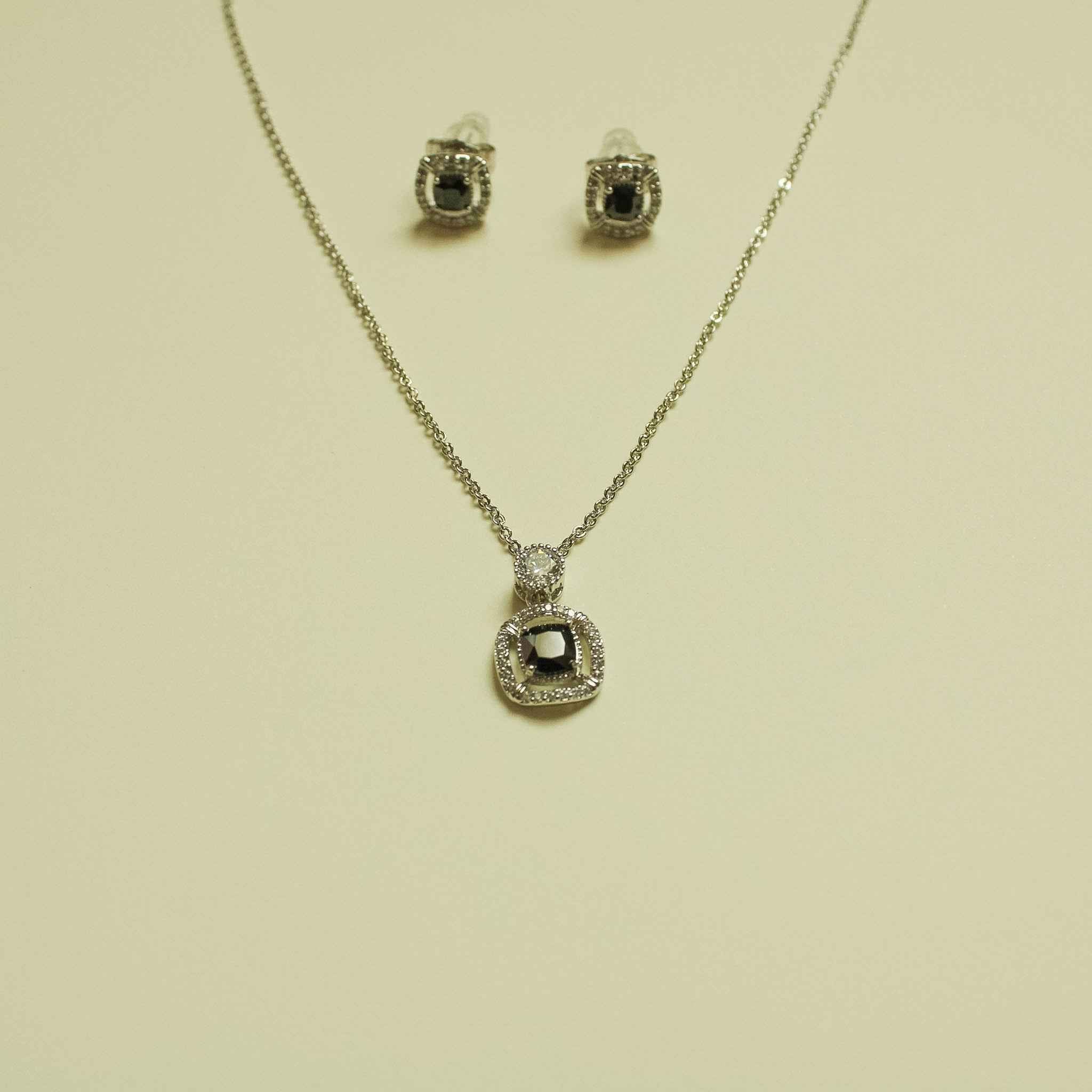 CZ halo pendant necklace and stud earrings with black center round halo design