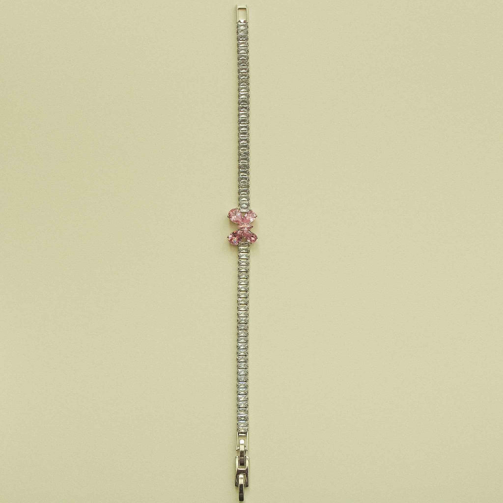 Silver CZ baguette bracelet with pink crystal accent and metal clasp extender