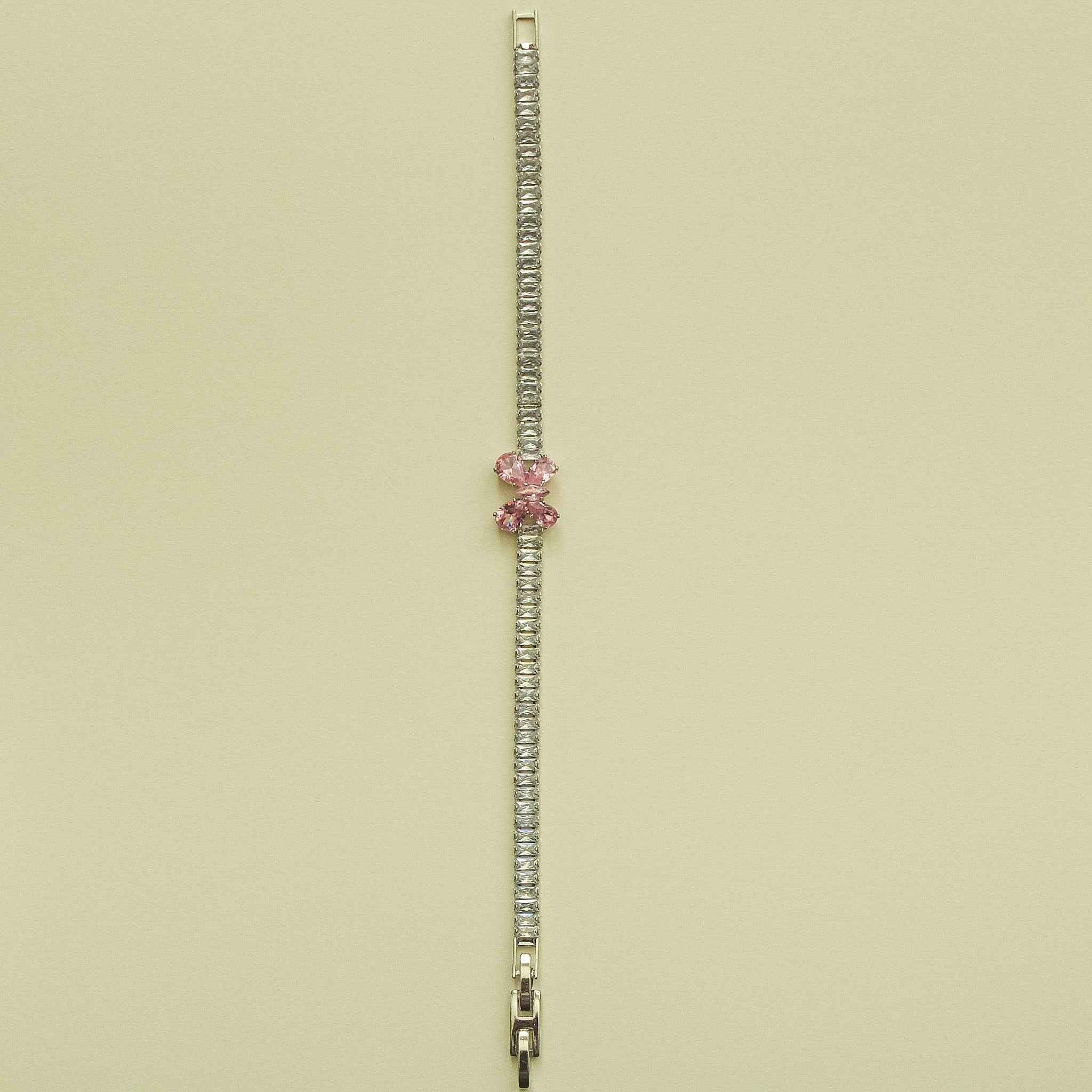 Silver CZ baguette bracelet with pink crystal accent and metal clasp extender