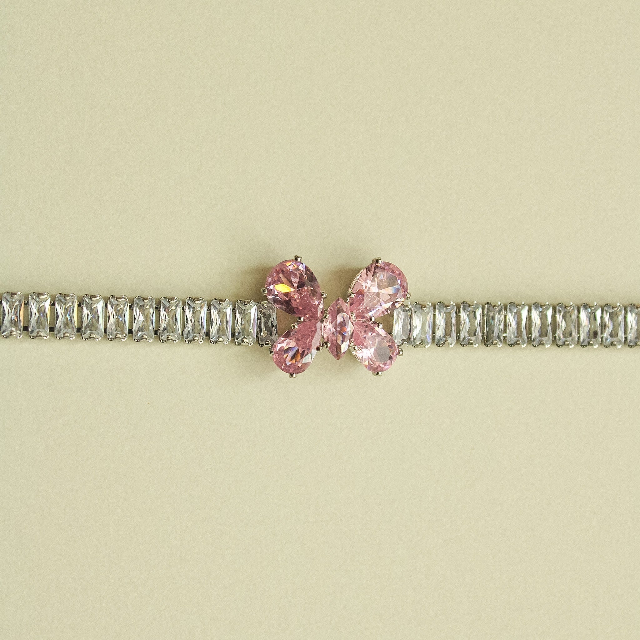CZ baguette bracelet with pink butterfly crystal center on silver rhinestone links