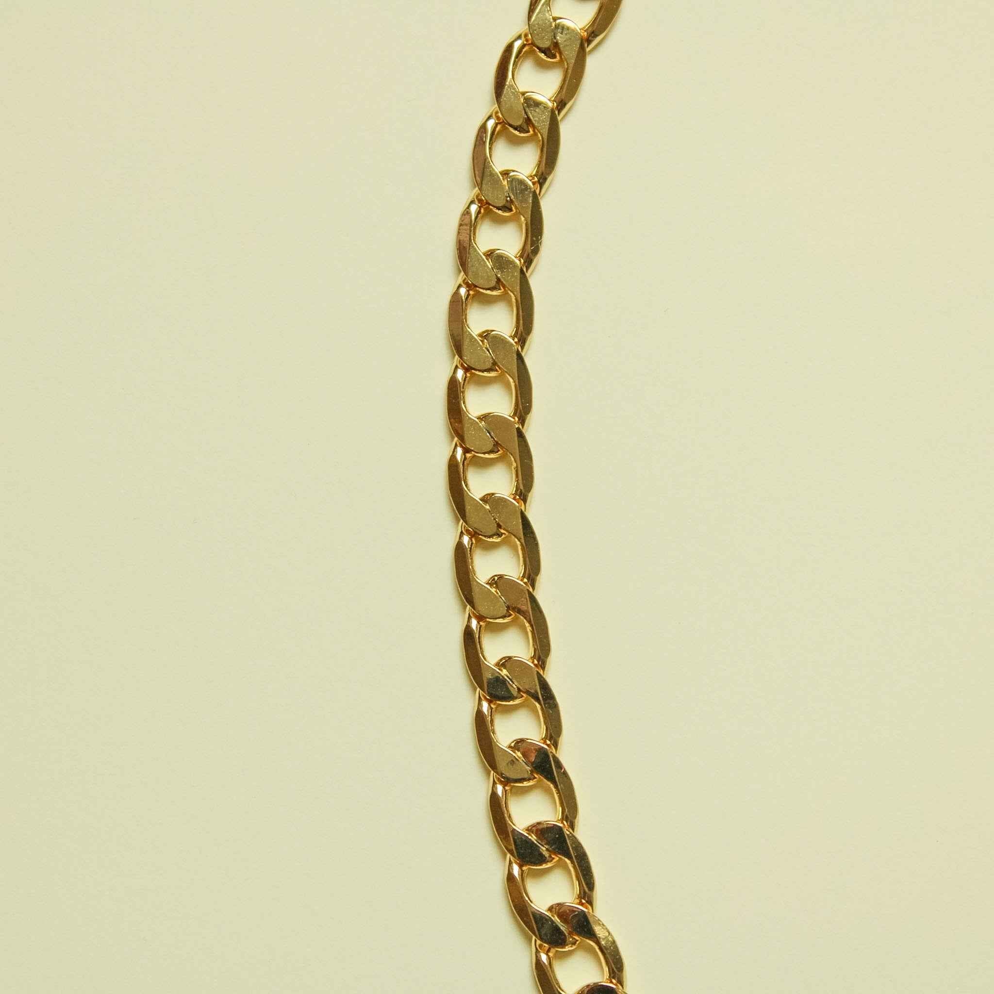 Chunky Cuban link 14K gold chain necklace, side view of thick polished links