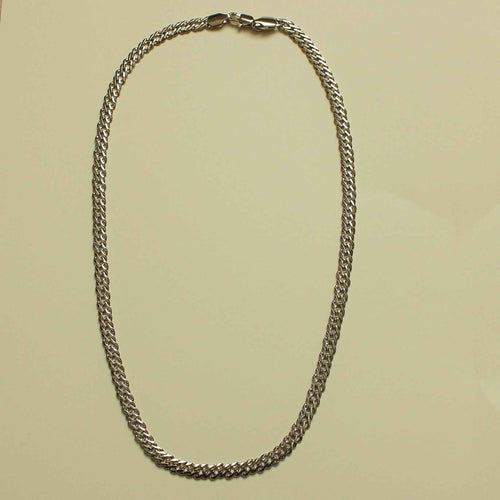 Chunky curb chain necklace arranged in an even loop of silver-tone links
