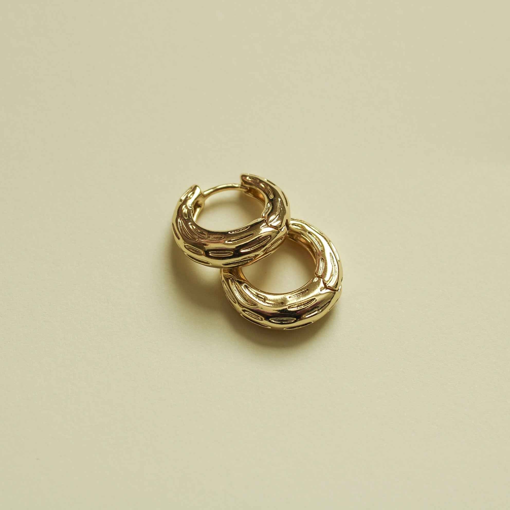 Gold chunky textured huggie hoop earrings, stacked oval-link style