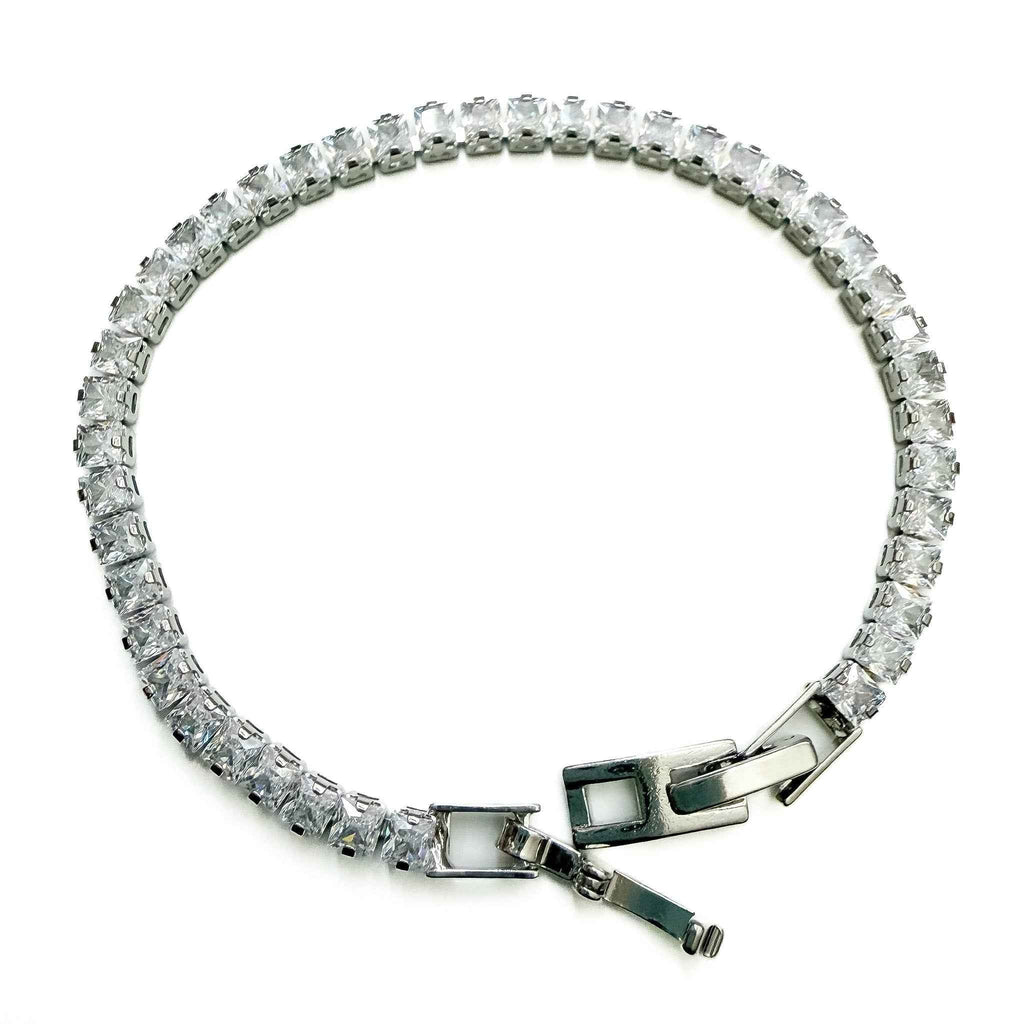 CZ tennis bracelet with clear stones and clasp with green enamel accents