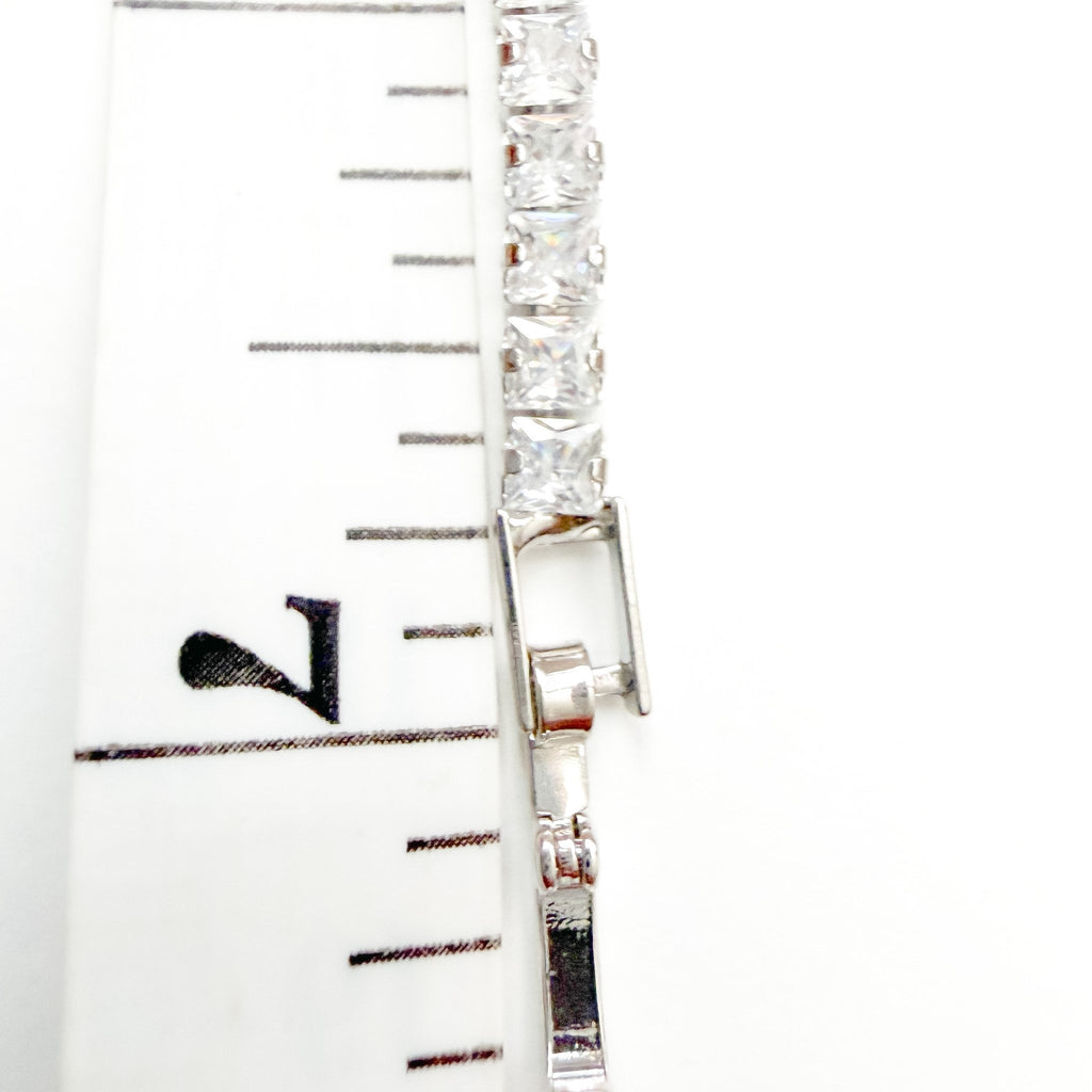 CZ tennis bracelet clasp with clear stones and metal bar detail