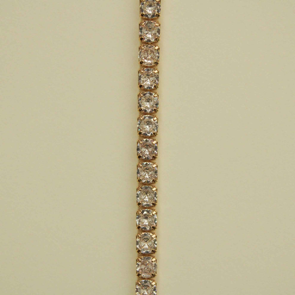 Gold-tone tennis bracelet with clear CZ row of round stones