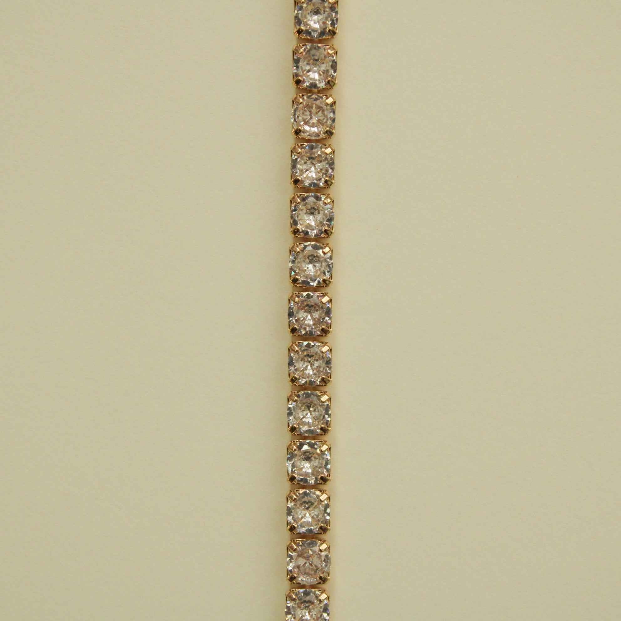 Gold-tone tennis bracelet with clear CZ row of round stones