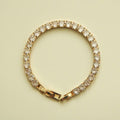 Gold-tone tennis bracelet with clear CZ stones and box clasp end links