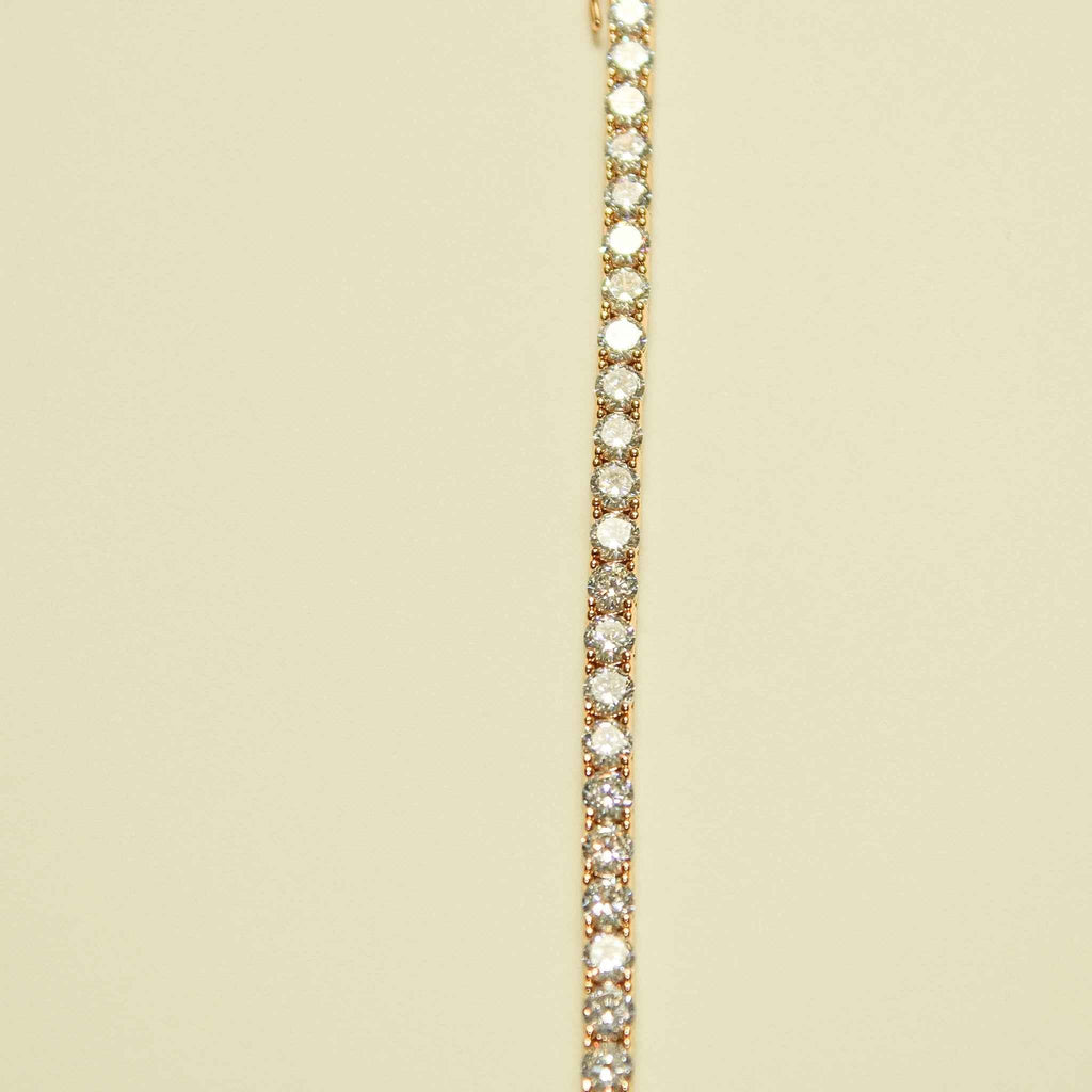 Rose gold-plated tennis necklace with bright round CZ stones, close-up row