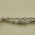 Clear CZ station bracelet side view showing round clear stones, prong stations, and clasp