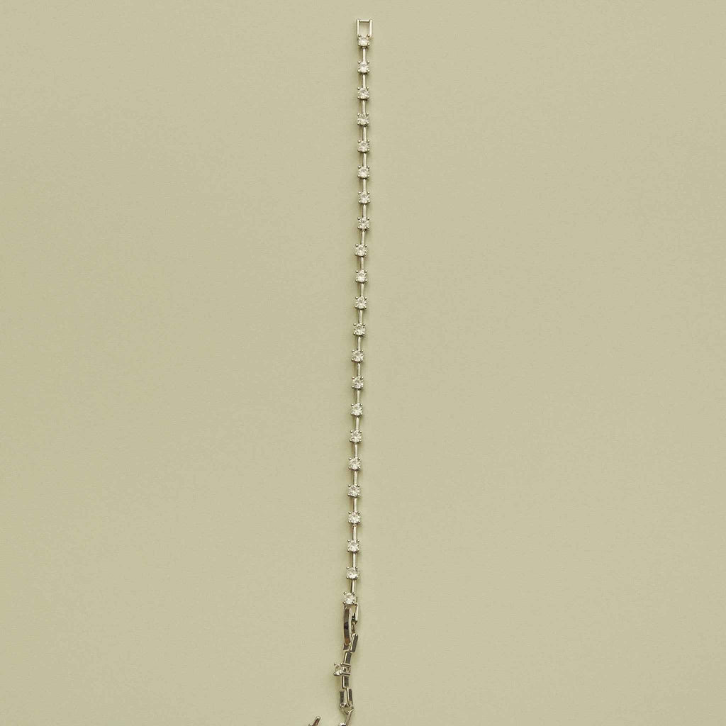 Clear CZ station bracelet with evenly spaced small round clear stones along the chain