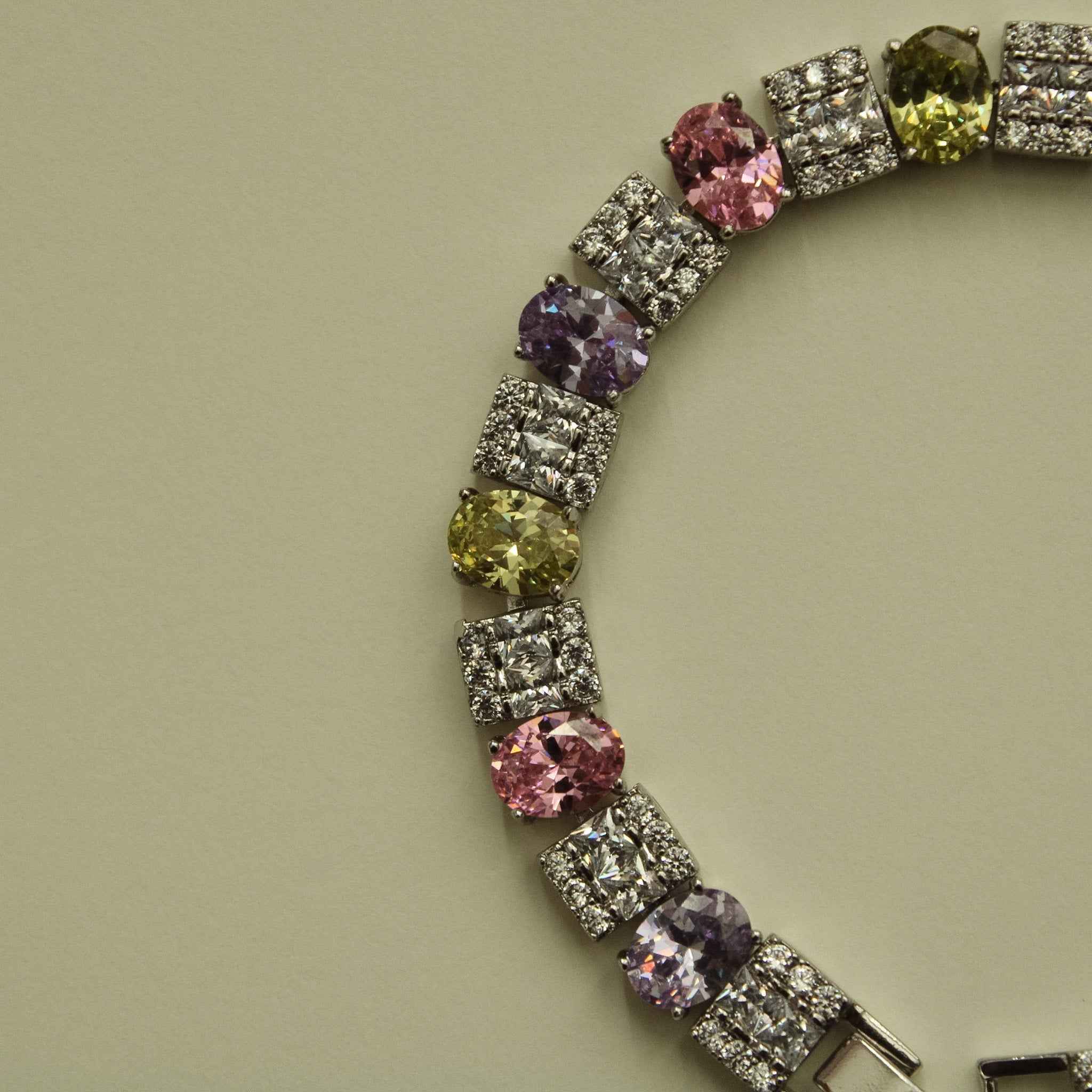 CZ tennis bracelet segment with round multicolor stones and square pave links