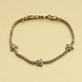 Silver-tone clear CZ star tennis bracelet with hinged link closure