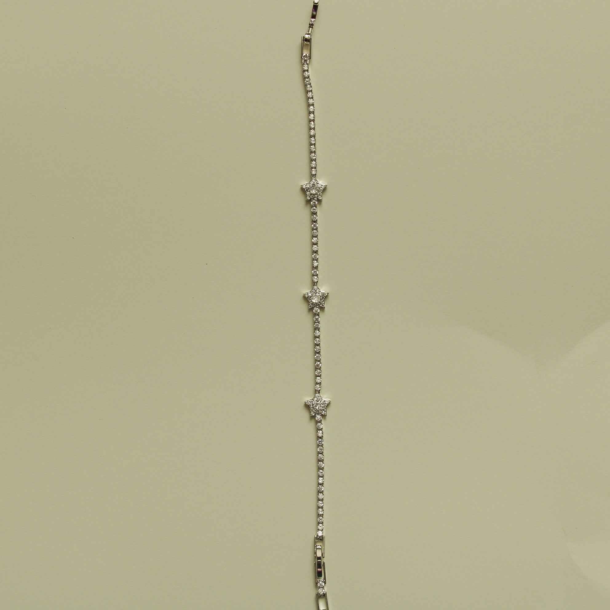 Clear CZ tennis bracelet with repeating star stations on a stone chain