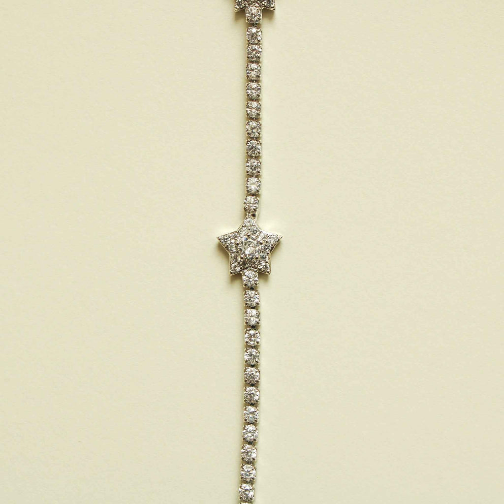 Silver-tone tennis bracelet with clear CZ star center and stone tennis links