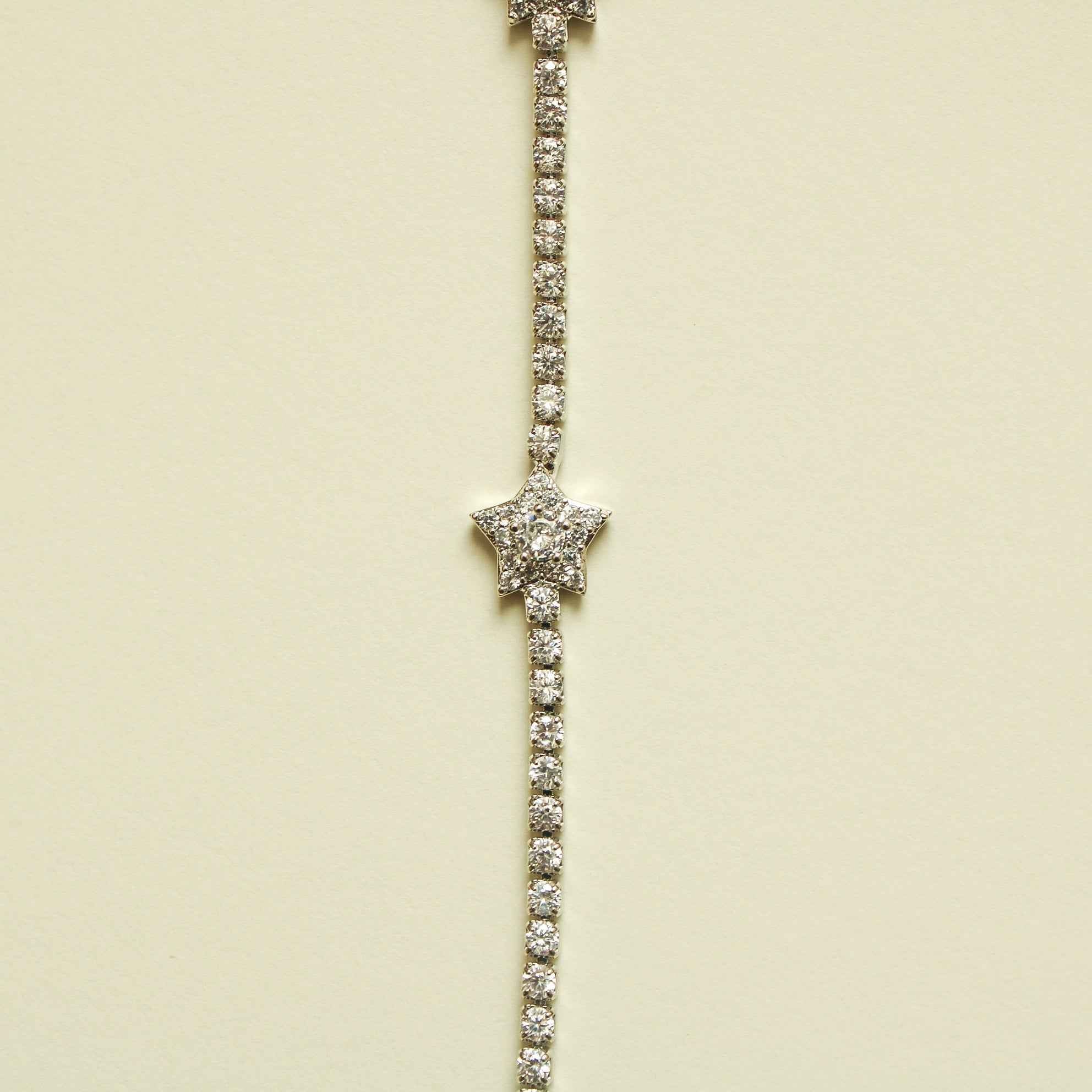 Silver-tone tennis bracelet with clear CZ star center and stone tennis links