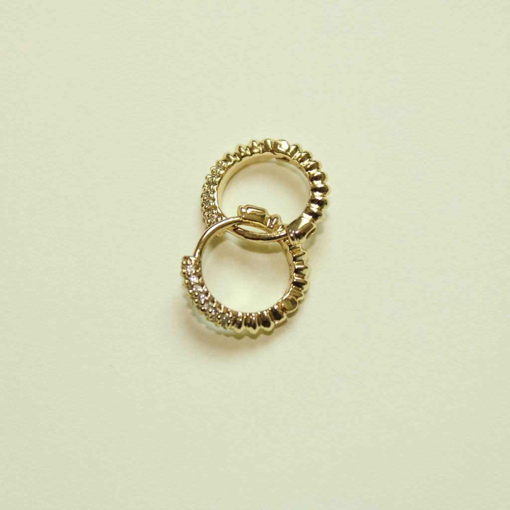 Gold pavé CZ huggie hoop earrings, overlapping pair