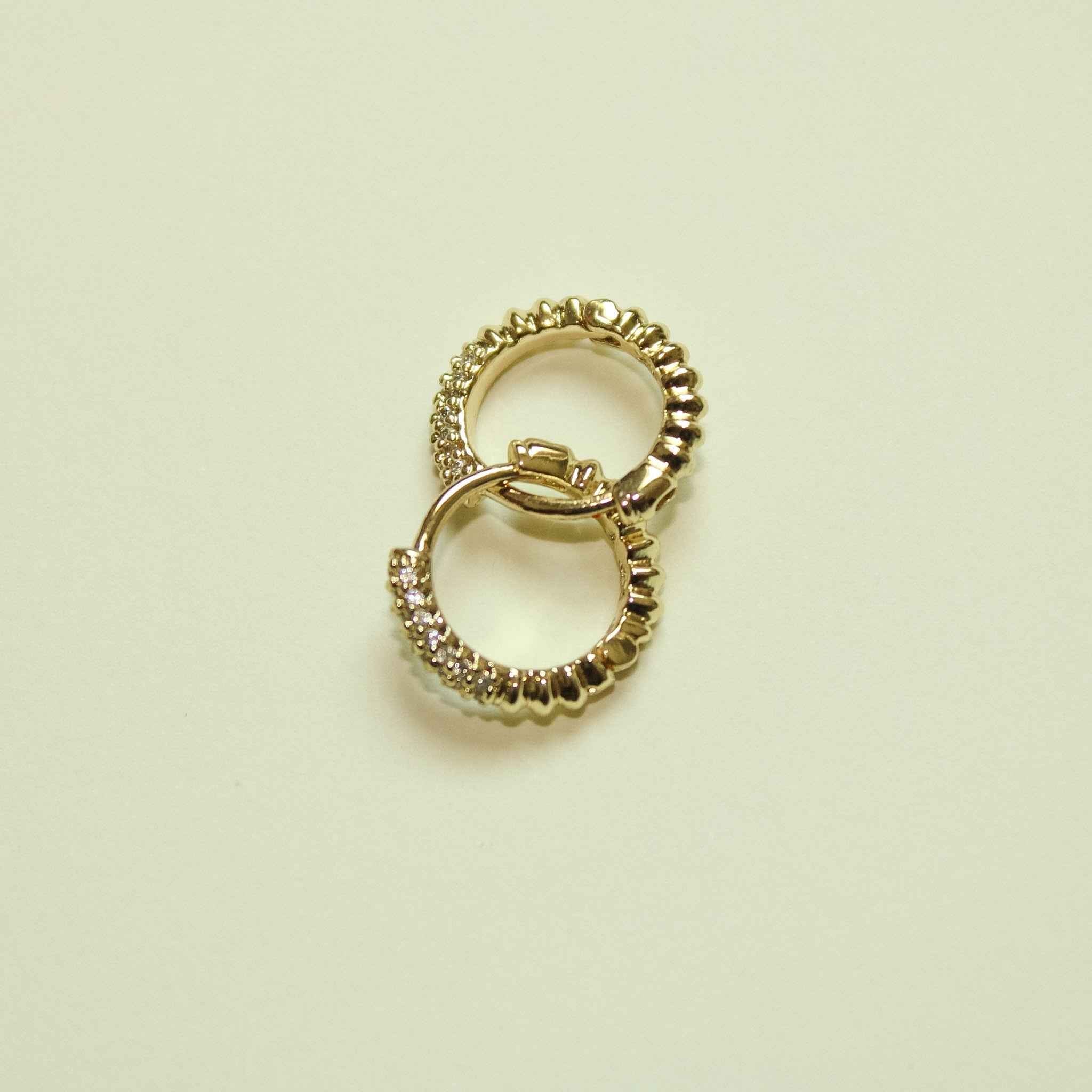 Gold pavé CZ huggie hoop earrings, overlapping pair