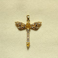 Gold dragonfly pendant with yellow center and clear rhinestone accents