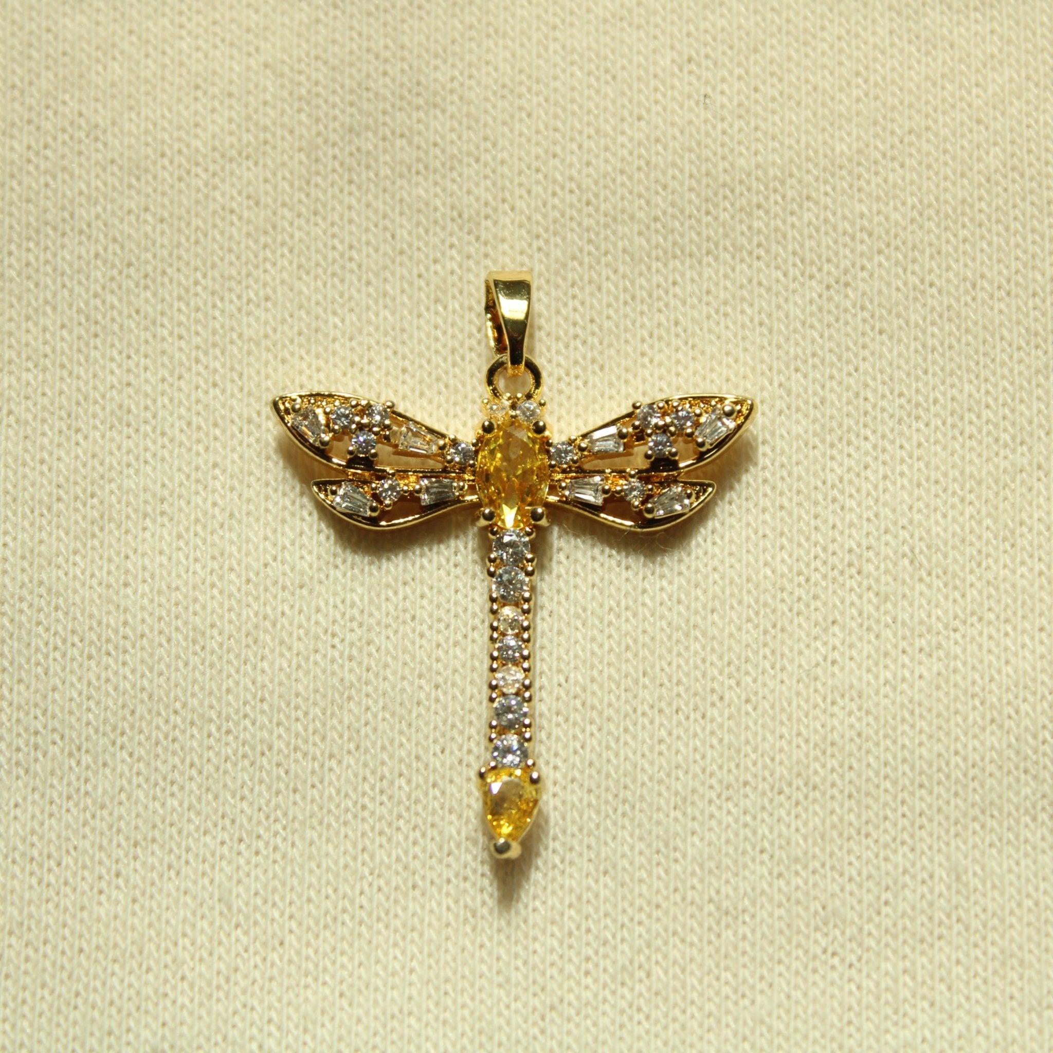 Gold dragonfly pendant with yellow center and clear rhinestone accents