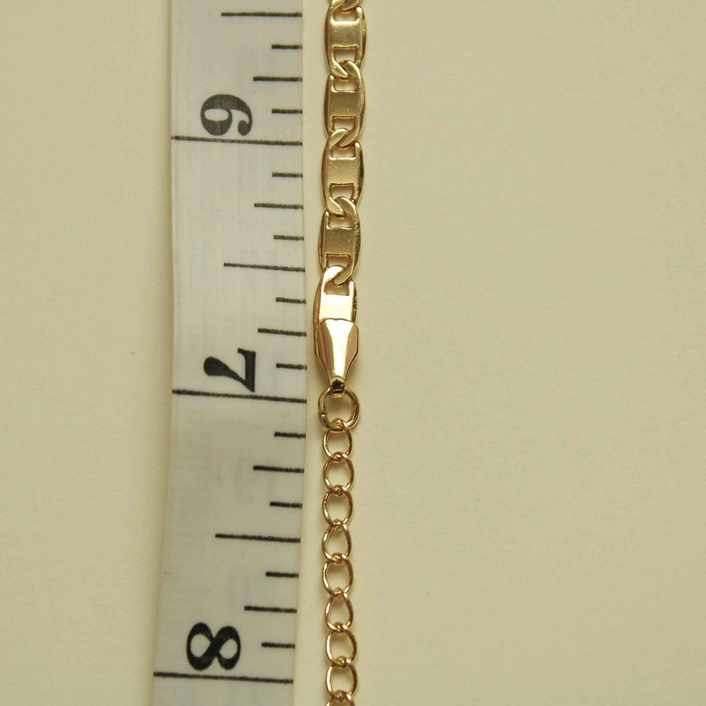 Gold-tone bracelet link chain with clasp; close-up side view.