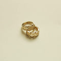 Gold huggie hoop earring with Greek key engraved pattern, small round hoop