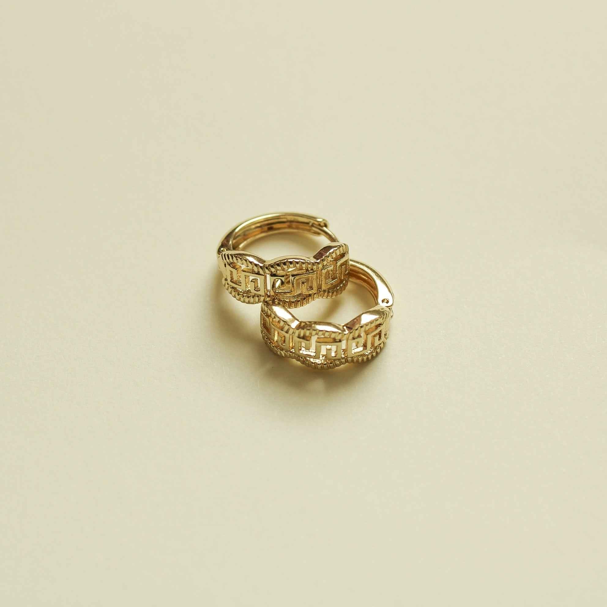 Gold huggie hoop earring with Greek key engraved pattern, small round hoop