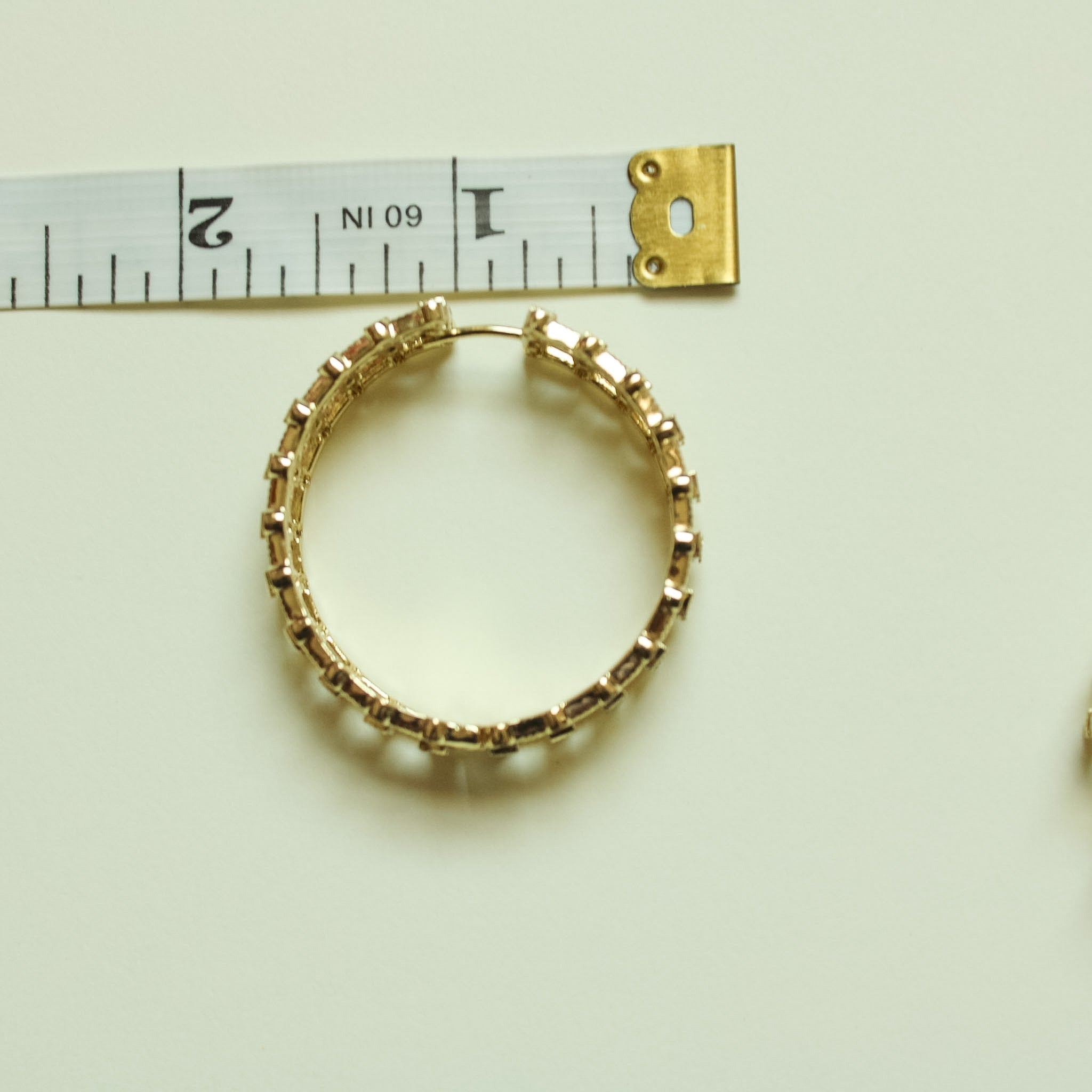 Gold-tone CZ inside-out hoop earring