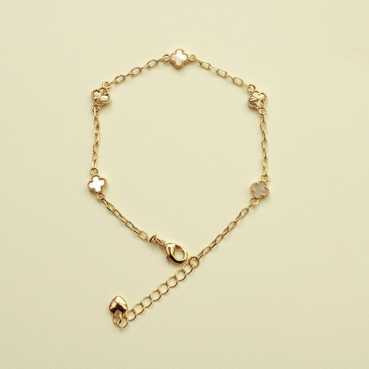 Gold-tone clover bracelet with mother-of-pearl inlay charms