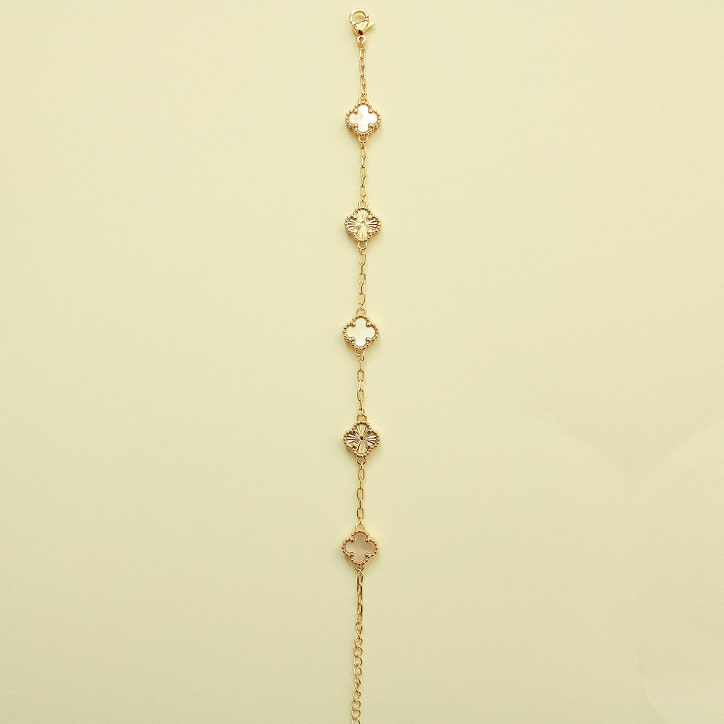 Gold bracelet hanging view with multiple clover charms and mother-of-pearl inlays