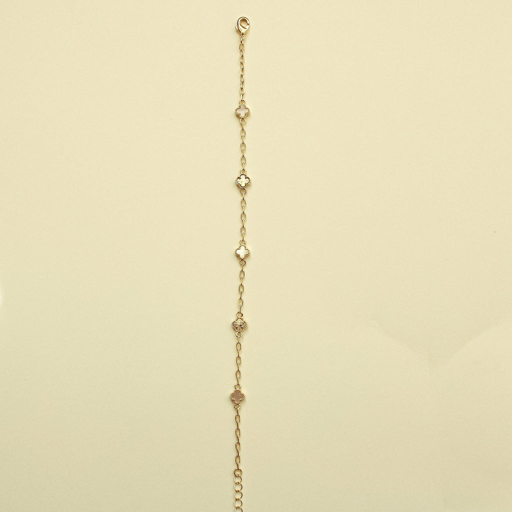 Gold chain bracelet with small clover charms and mother-of-pearl inlays, top loop