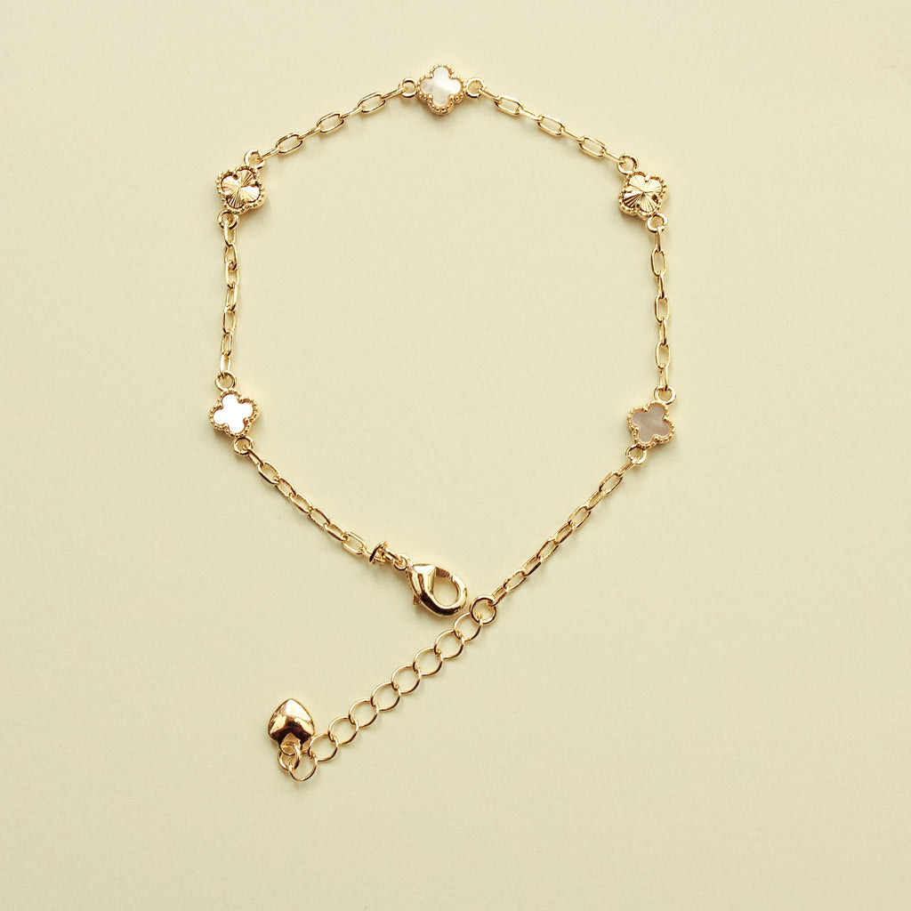 Gold-tone clover bracelet with mother-of-pearl inlay and toggle clasp